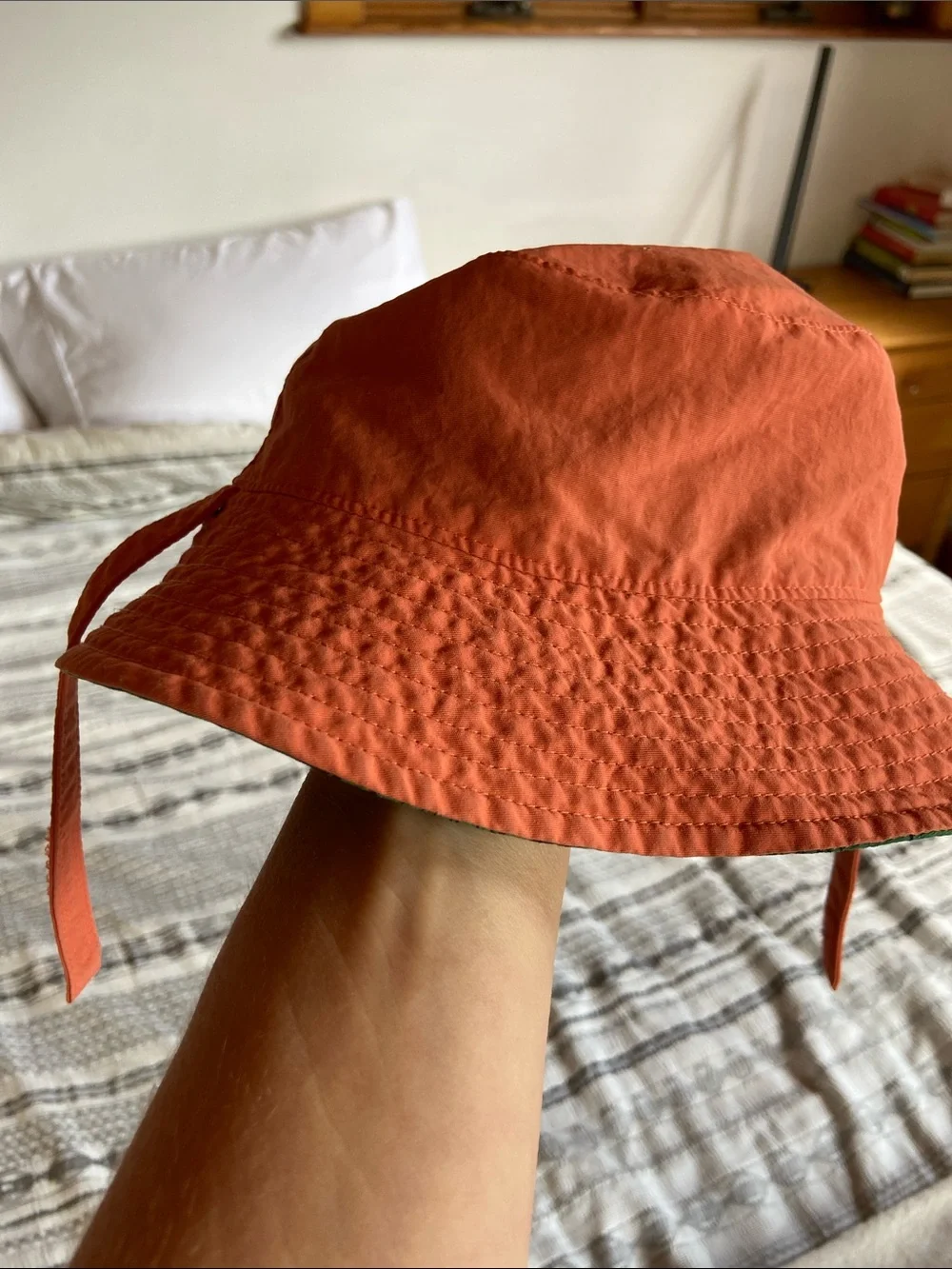 Patagonia Green Kids Sun Bucket Hat with Navy Fish and Floral Print.